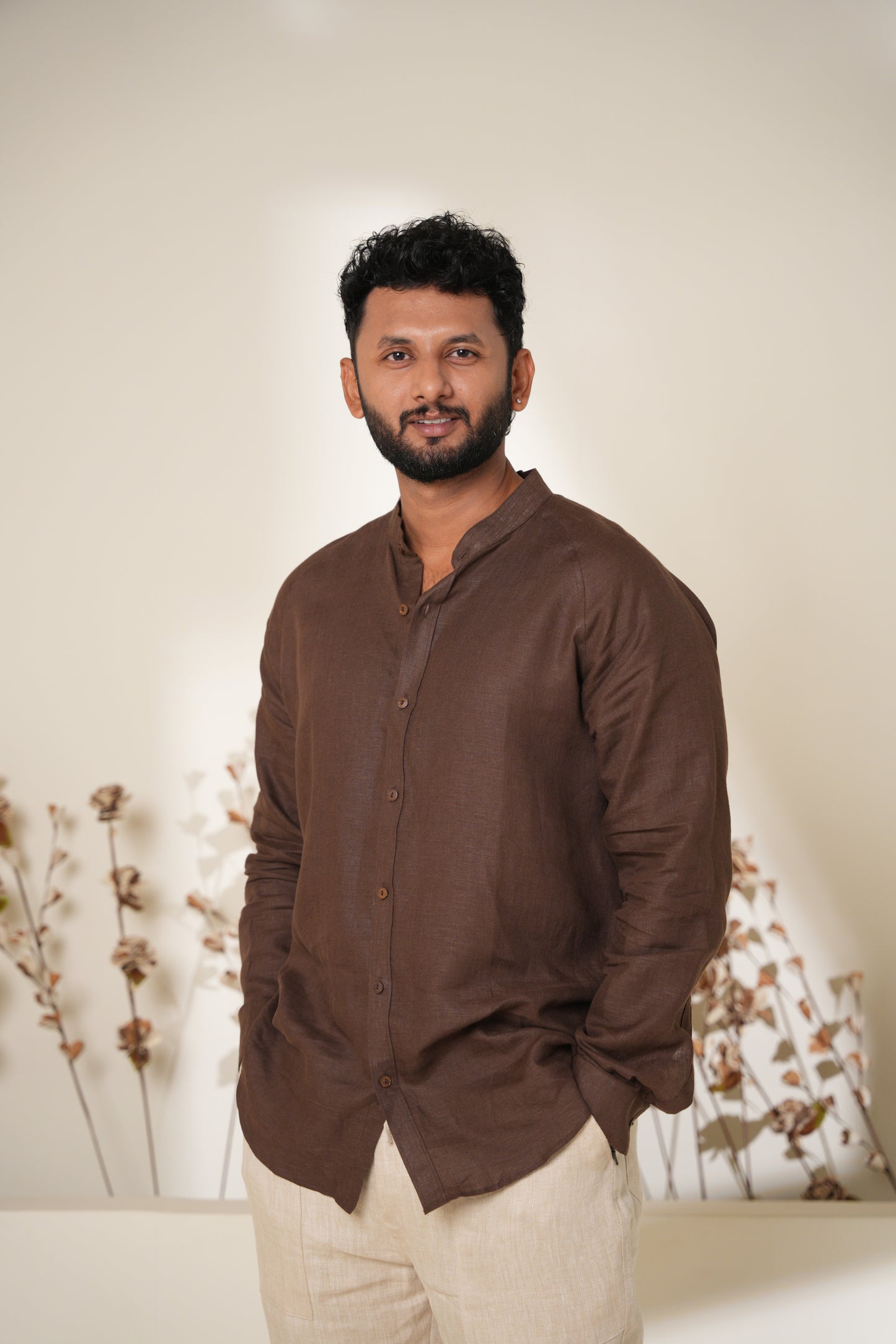 Stylish raglan sleeve shirt in rich brown, featuring contrasting sleeves and a relaxed fit for a modern casual look.