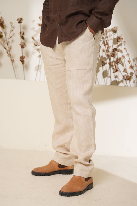 Elegant beige trousers with a herringbone weave design, combining comfort and style for any occasion.