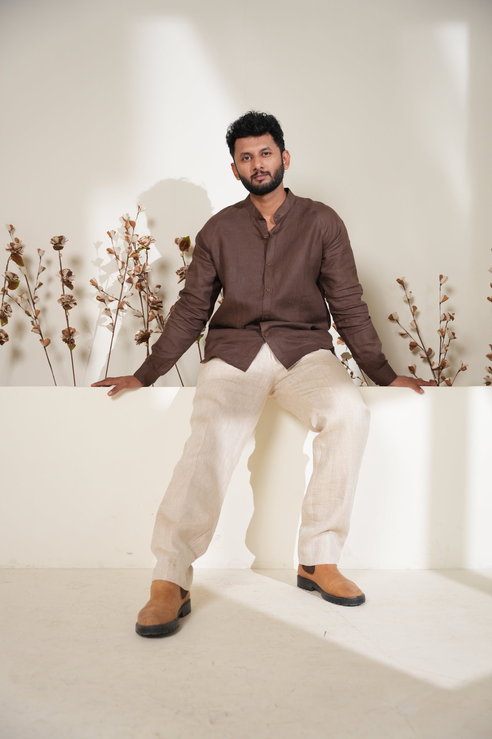 Chic rich brown raglan sleeve shirt with a sleek design, offering comfort and style for everyday wear.