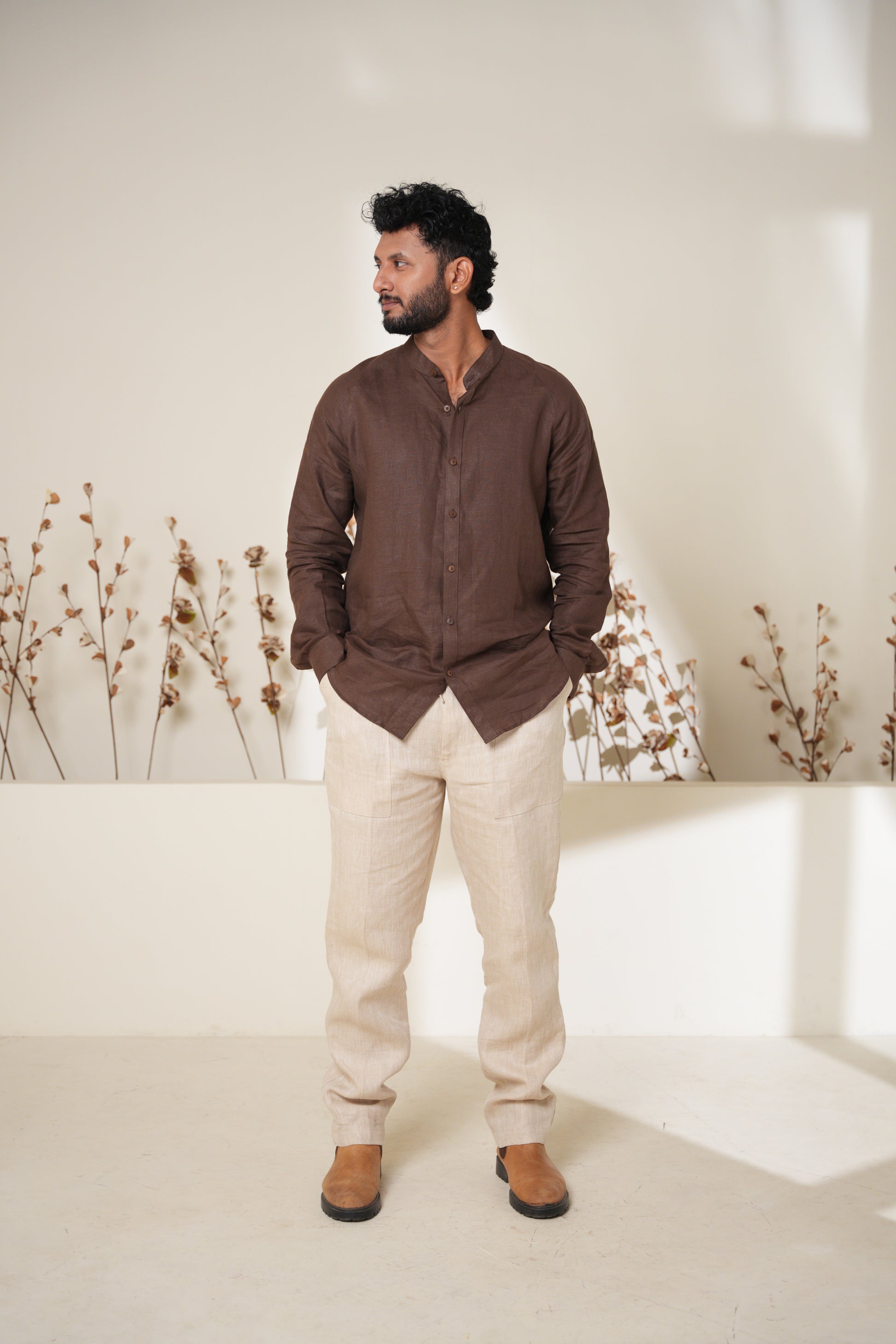 Casual yet trendy raglan sleeve shirt in rich brown, perfect for creating a laid-back, contemporary outfit.