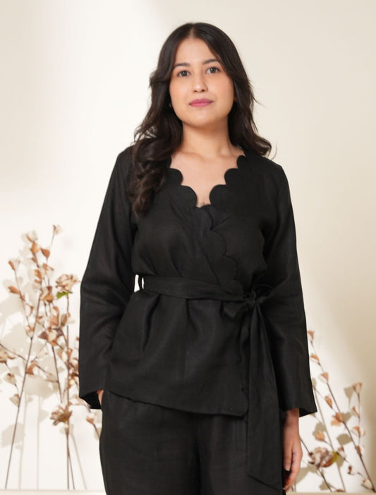 Chic wrap-around top with a flattering tie waist design, offering a stylish and feminine silhouette.