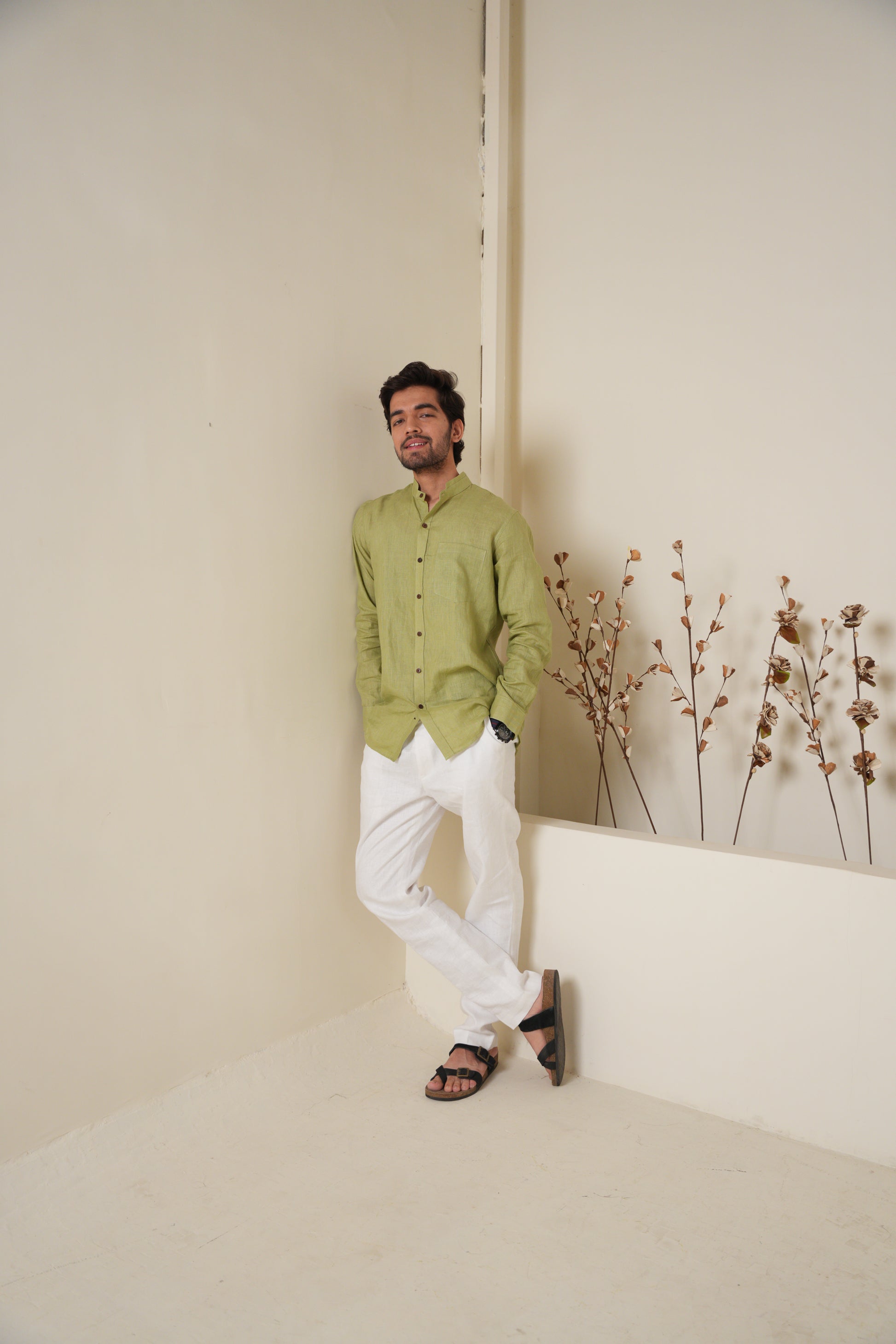 Stylish sage green short kurta featuring a simple, clean design for a versatile look.