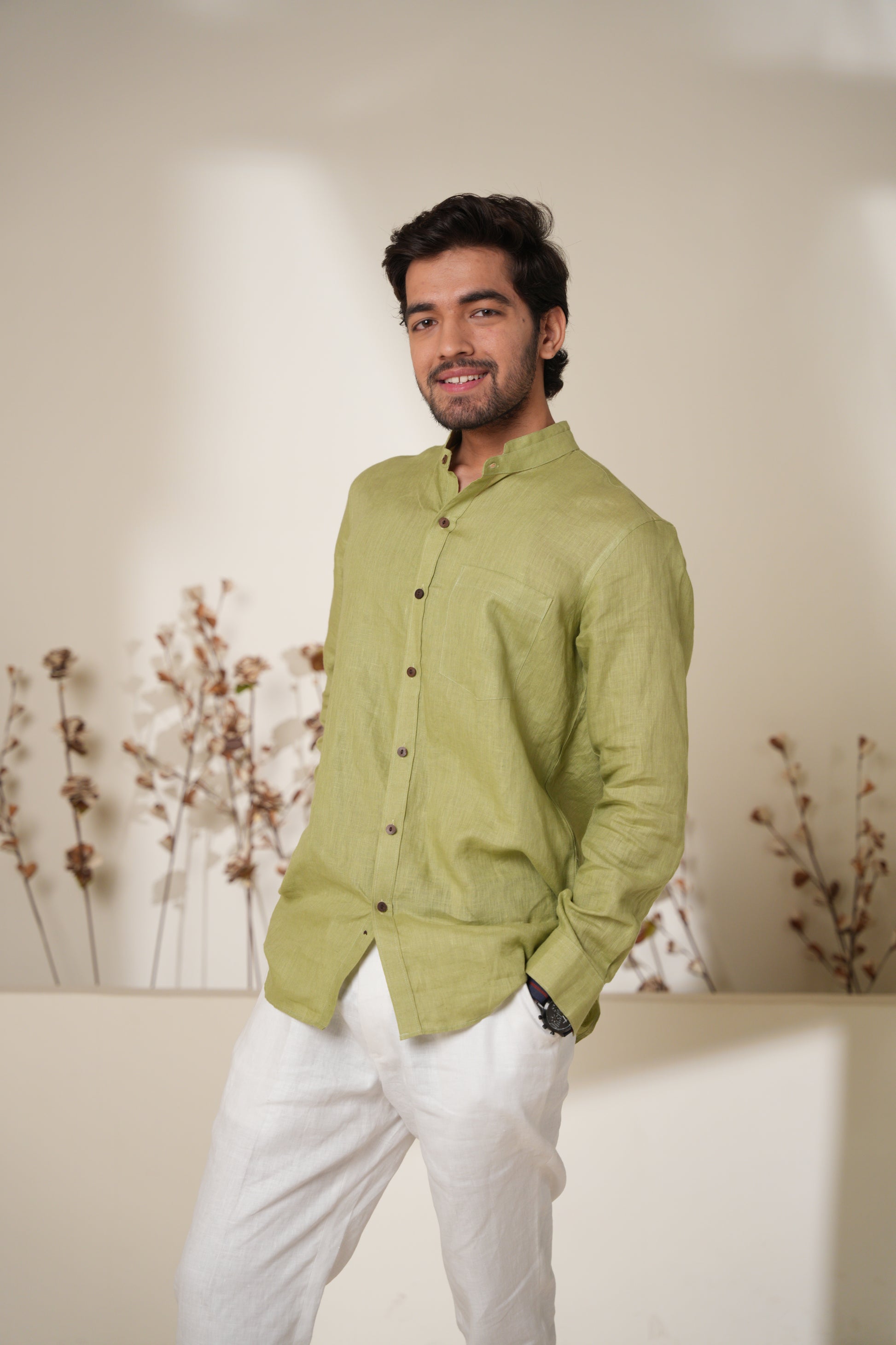 Stylish raglan sleeve shirt in sage green, featuring contrasting sleeves and a relaxed fit for a casual, modern look.