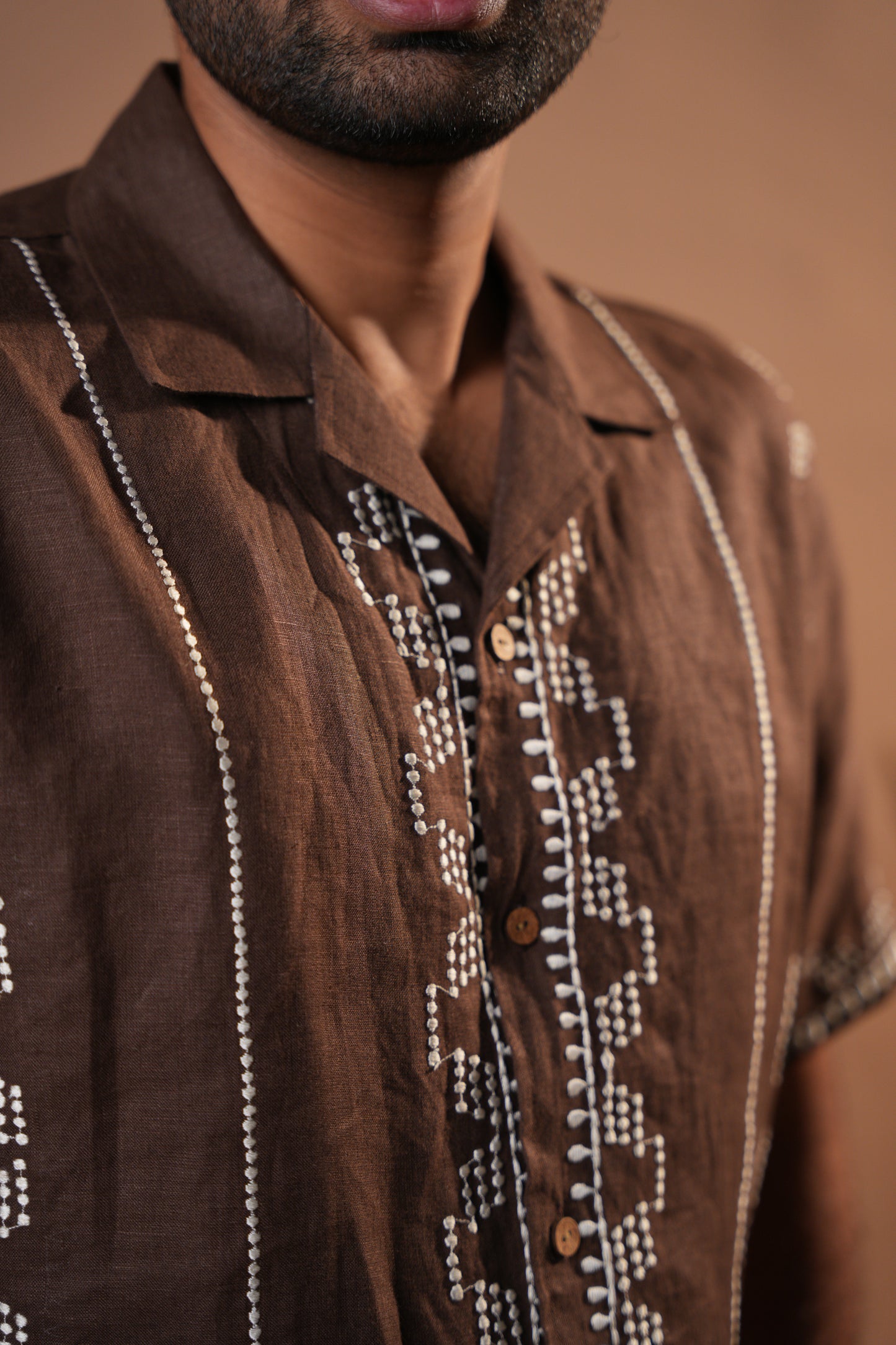 Rich brown shirt with intricate embroidery, ideal for casual and semi-formal occasions.