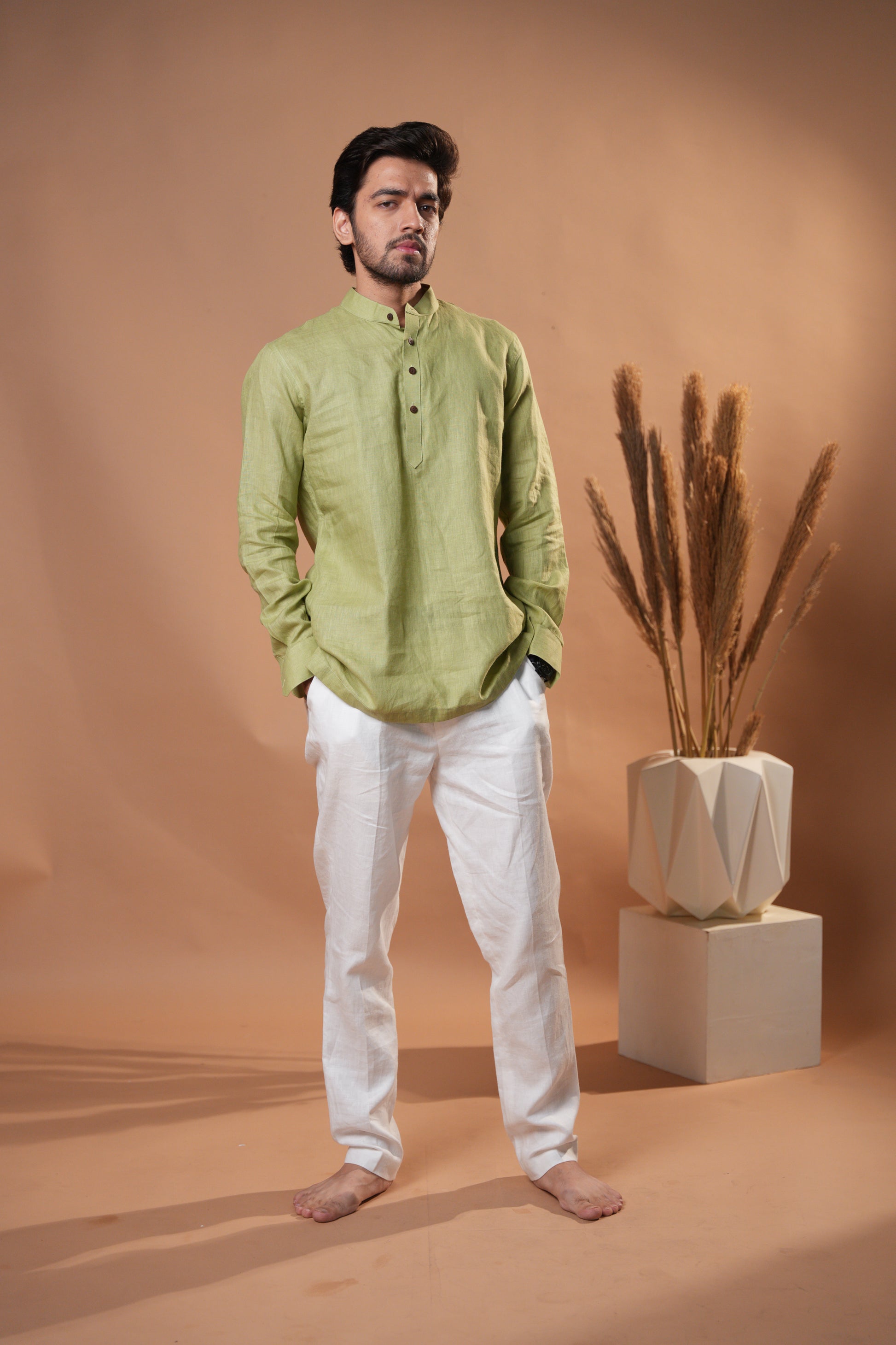 Chic sage green raglan sleeve shirt with a comfortable, easygoing design, perfect for everyday wear.