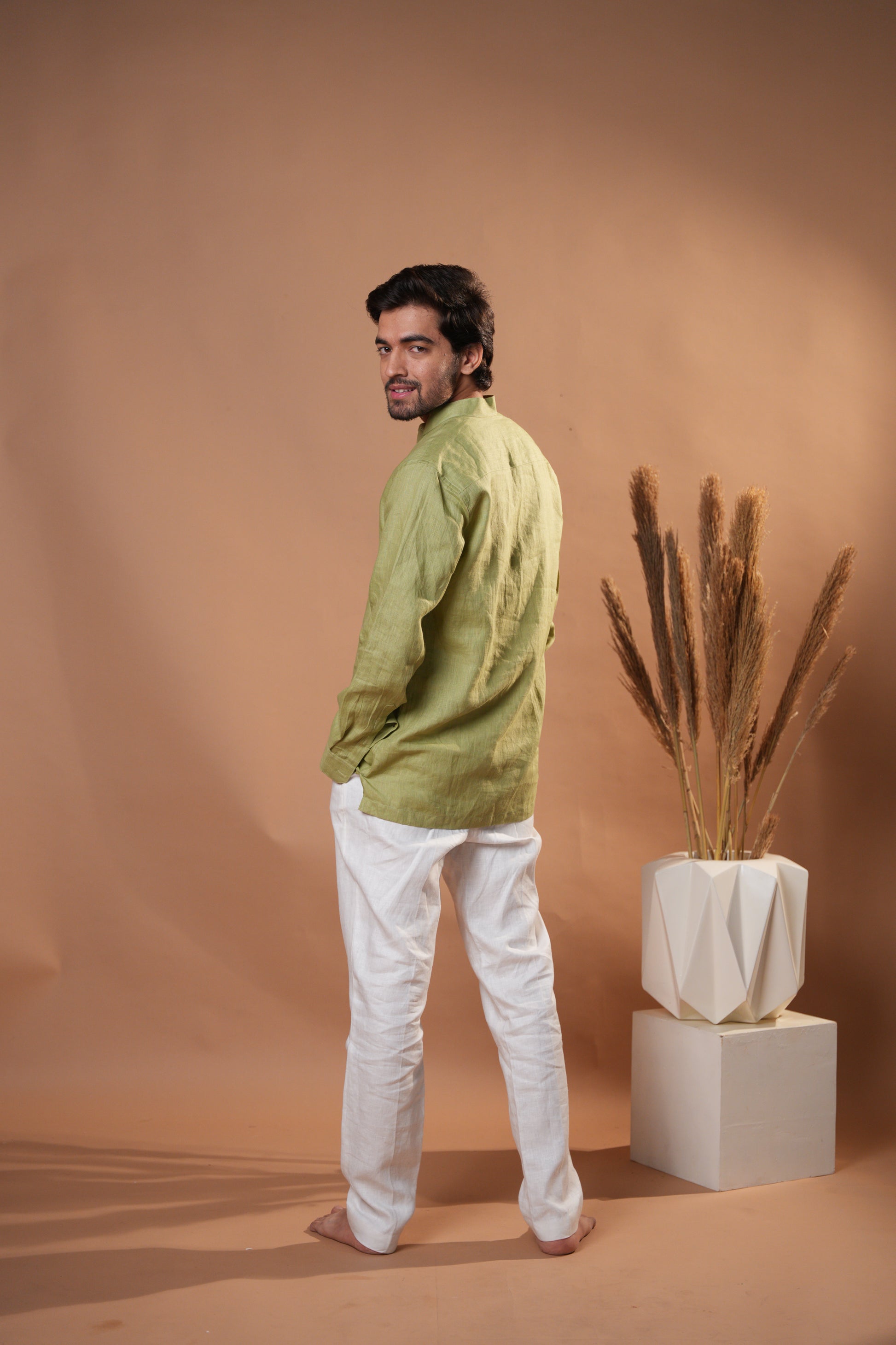 Casual raglan sleeve shirt in sage green, offering a versatile and stylish option for a laid-back outfit.