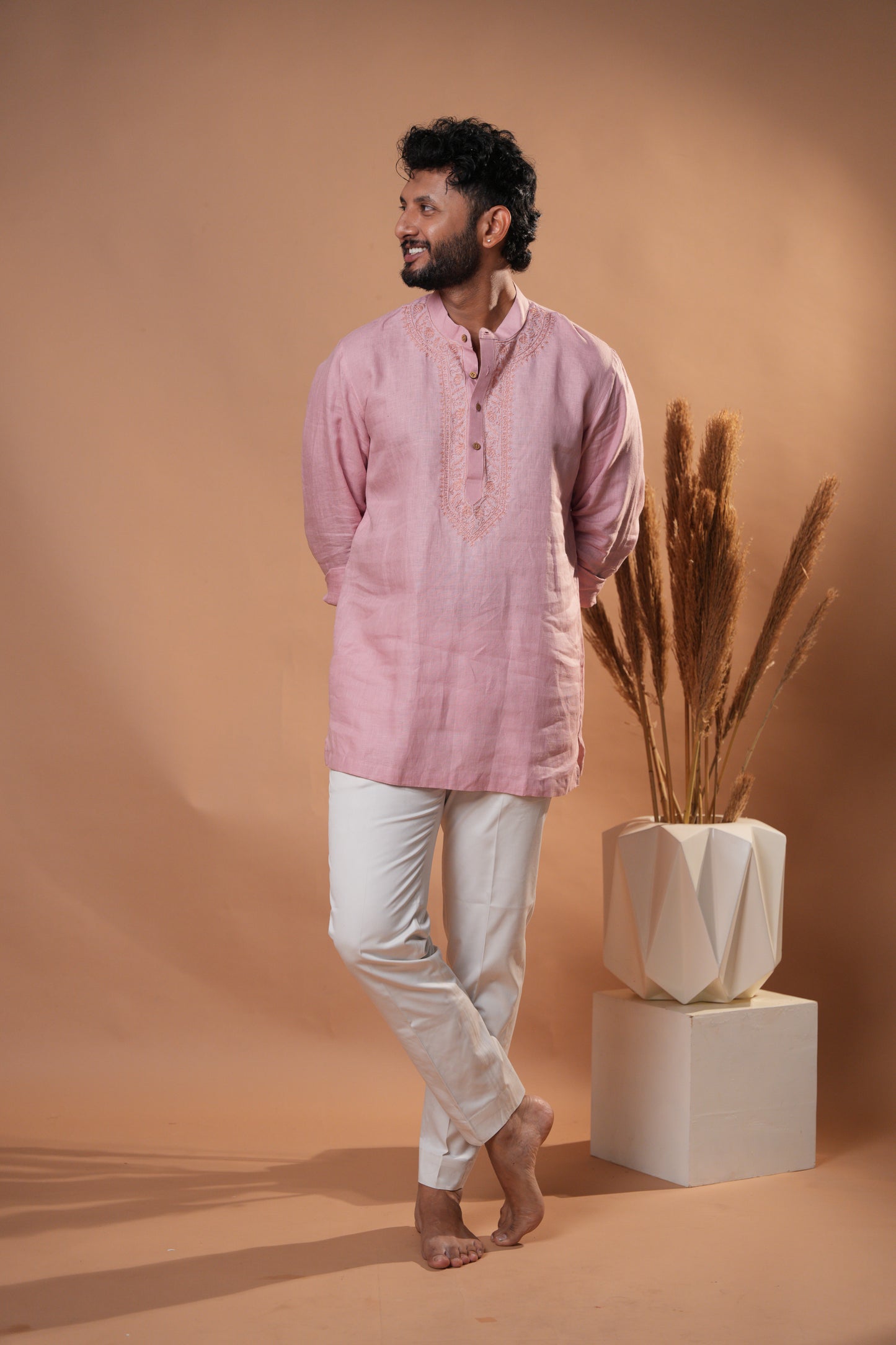 Soft pink Chikankari kurta, perfect for casual wear or festive occasions, with beautiful embroidery details.