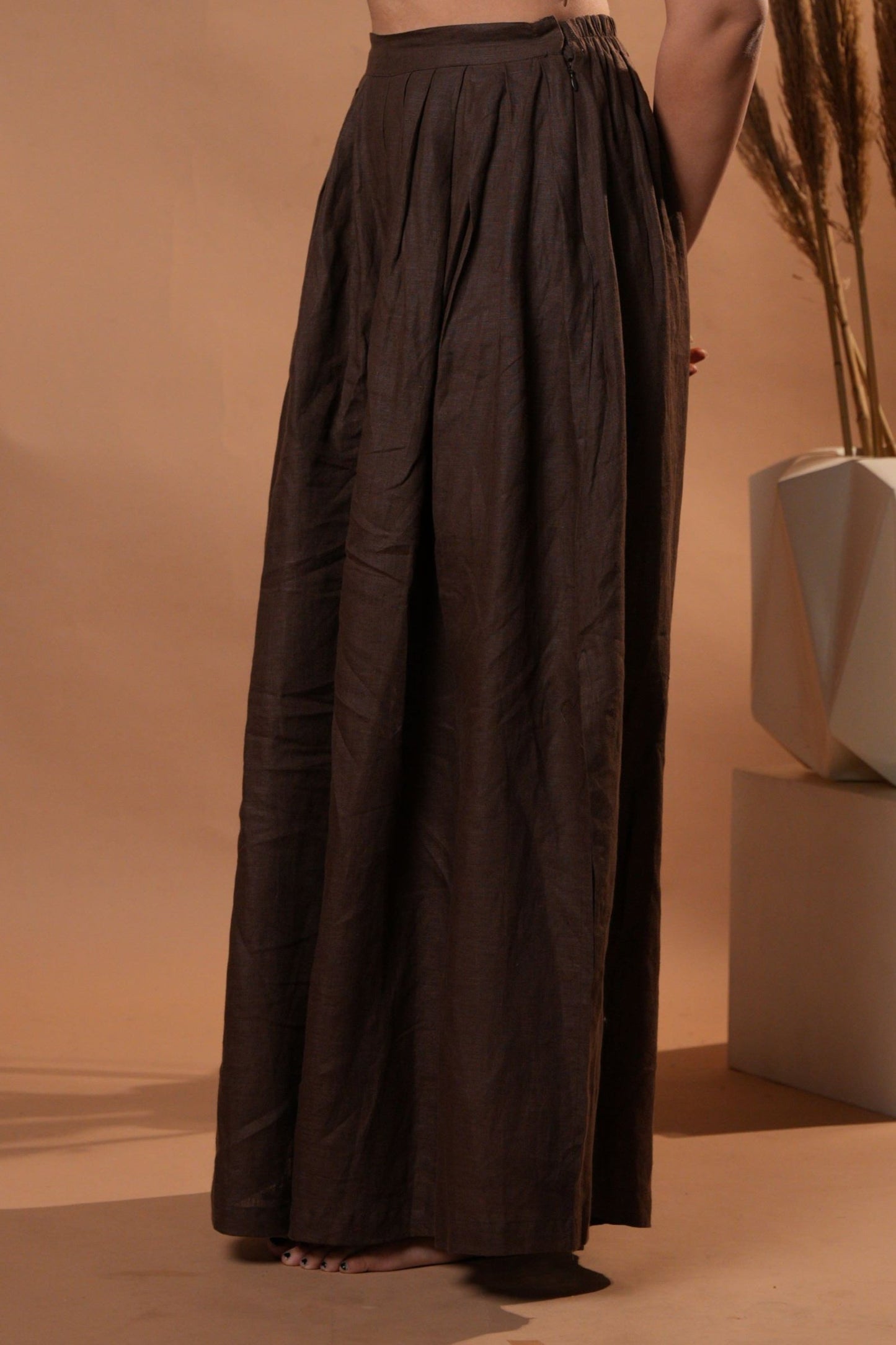 Elegant pleated side slip pants featuring a flowy design with subtle pleats for a refined, relaxed look.