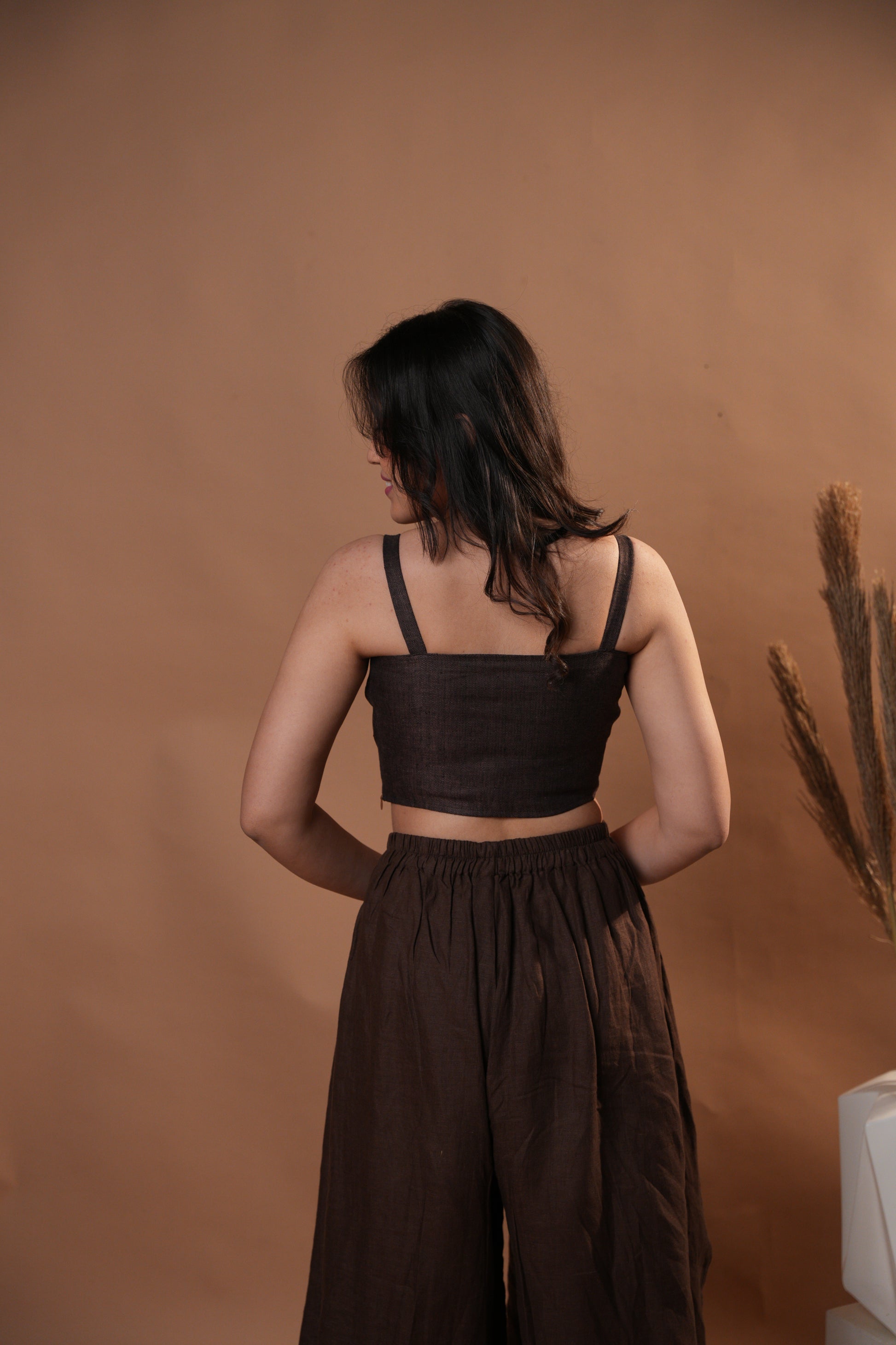 Close-up of a herringbone corset top, showcasing the unique diagonal pattern and fitted design.