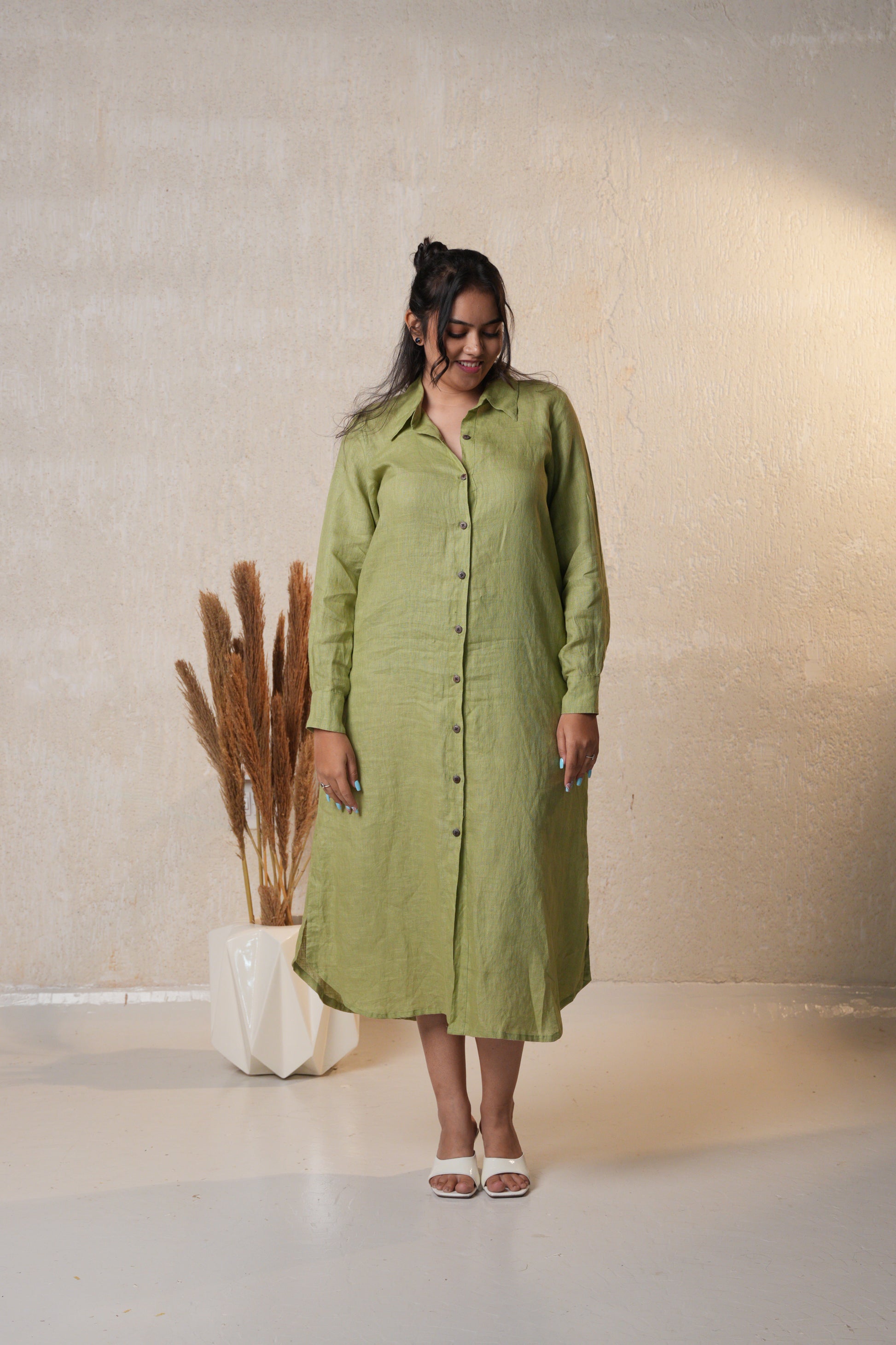 Stylish long shirt dress featuring a classic collar and long sleeves for a polished, casual look.