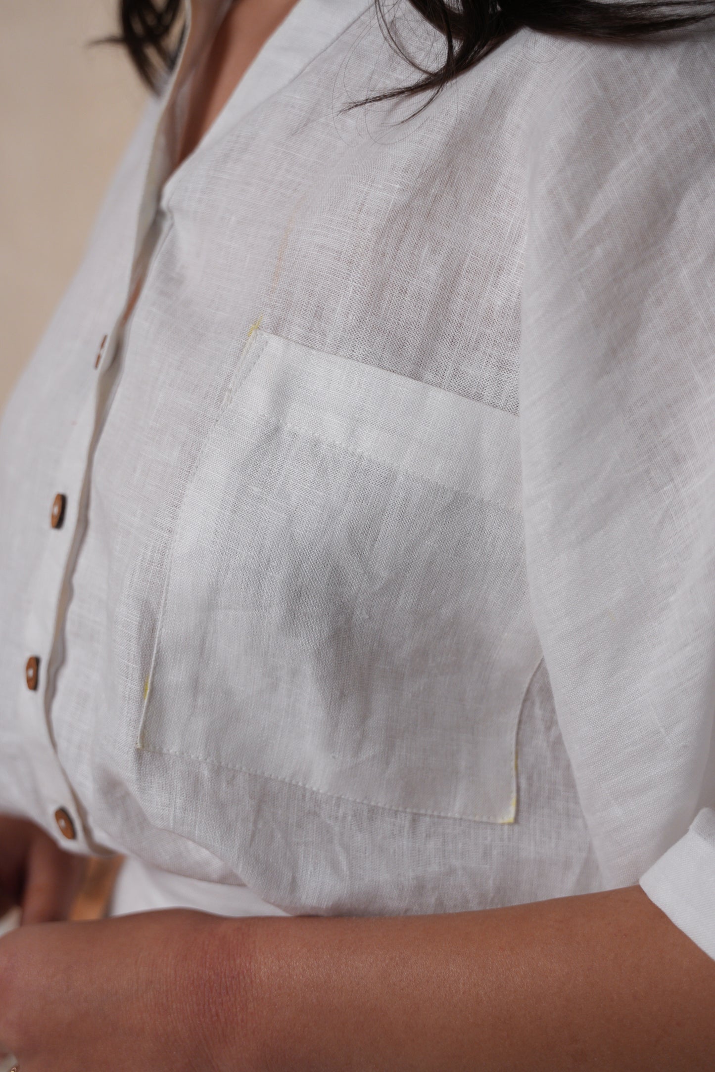 Close-up of a no armhole shirt, showcasing the unique sleeveless design and lightweight fabric.