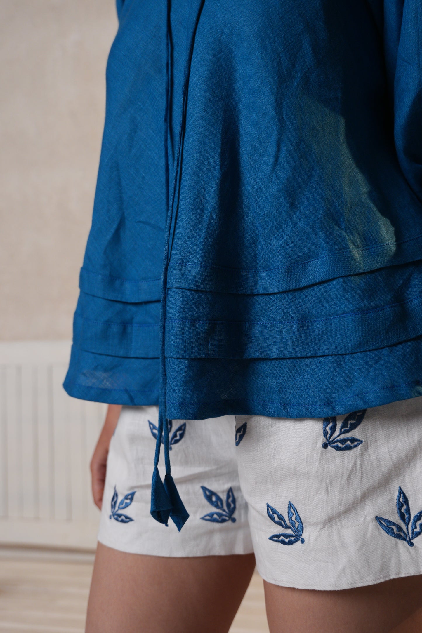 Women’s embroidered shorts with detailed patterns on the sides, offering comfort and style.