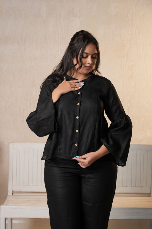 Chic bell sleeves shirt with a loose, flowing design for a feminine and stylish look.