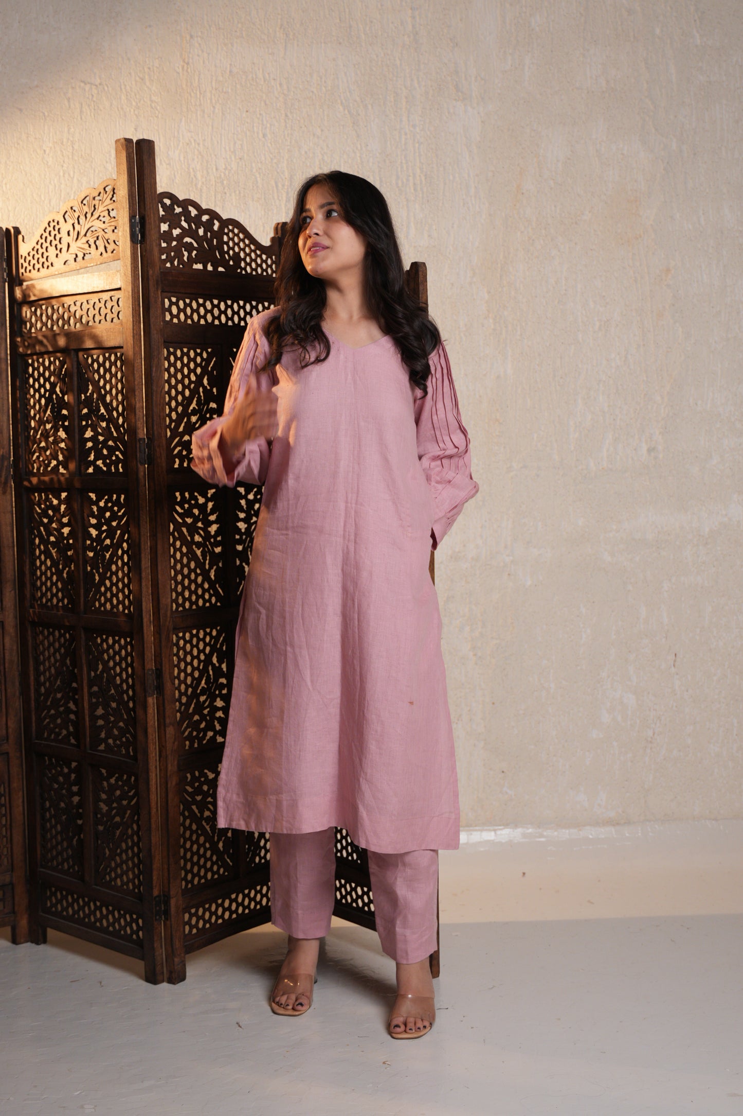 Close-up of a tucks sleeve kurta, highlighting the intricate sleeve detailing and relaxed fit.