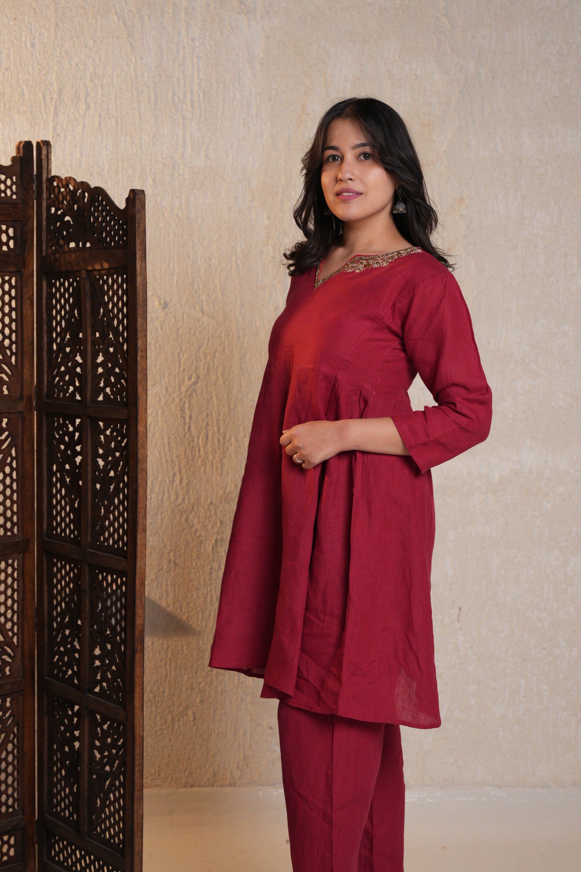 Elegant Zardozi embroidered kurta set with detailed stitching, perfect for festive and formal occasions.