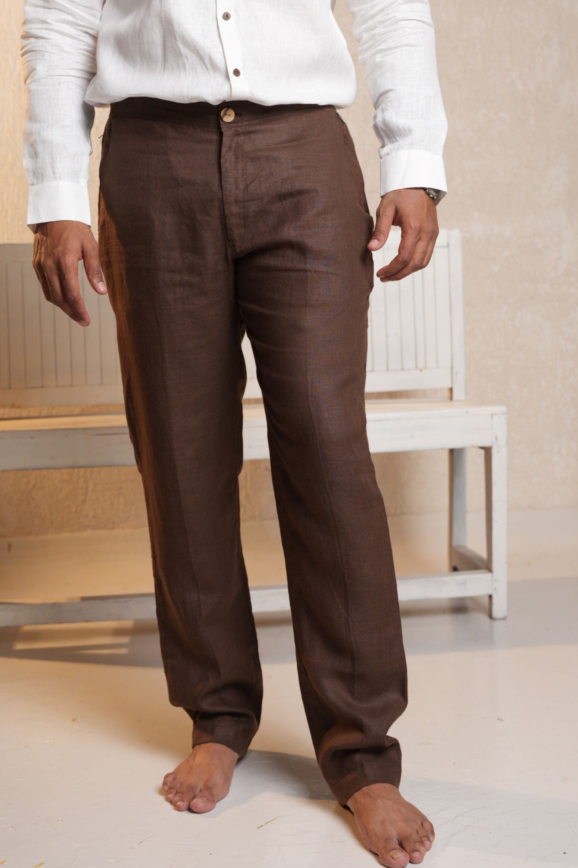 Sophisticated rich brown trousers with a tailored fit, offering a versatile and polished look for both casual and formal occasions.