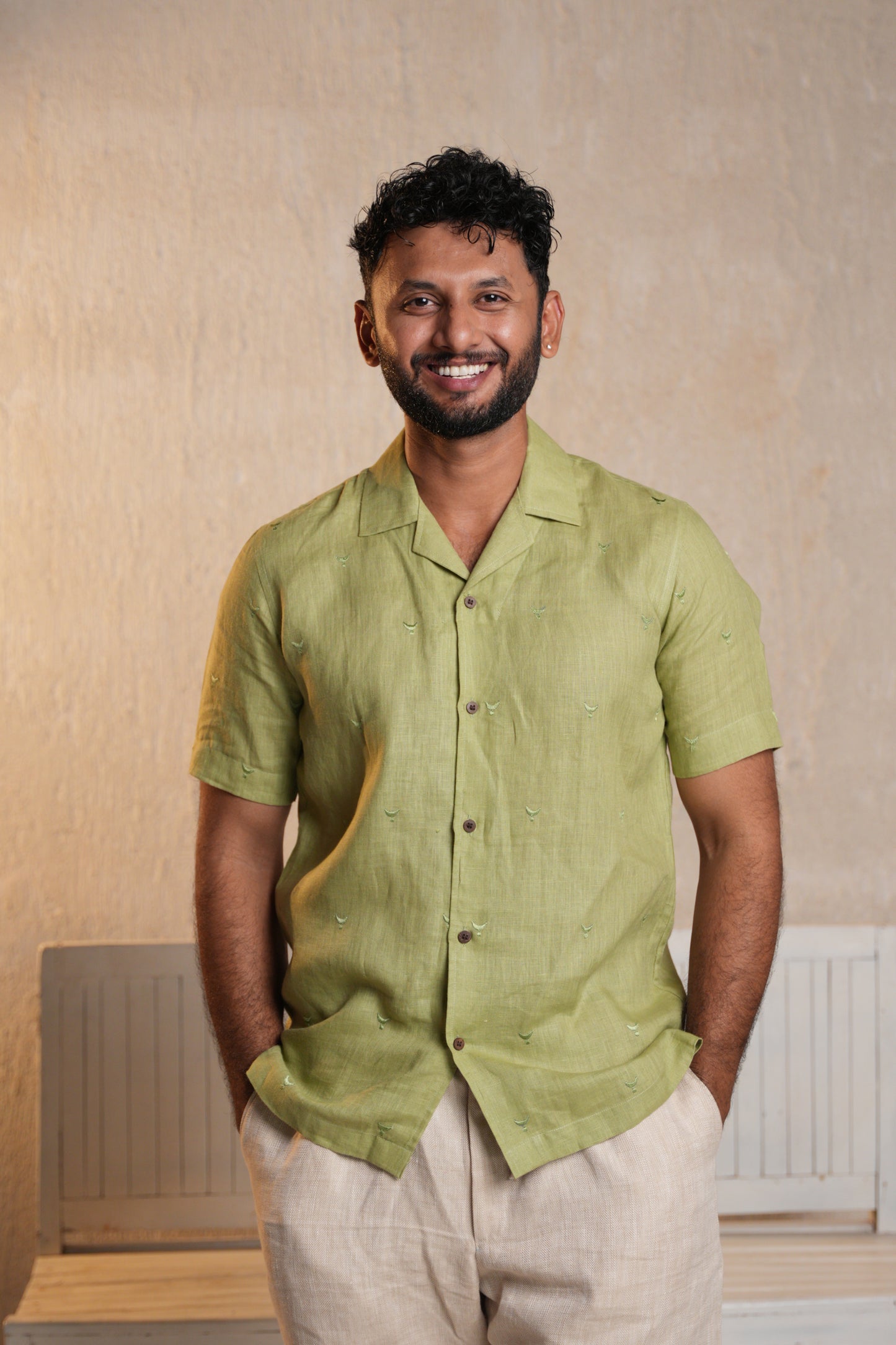 Casual embroidered shirt in sage green, featuring delicate stitching for a fresh, modern look.