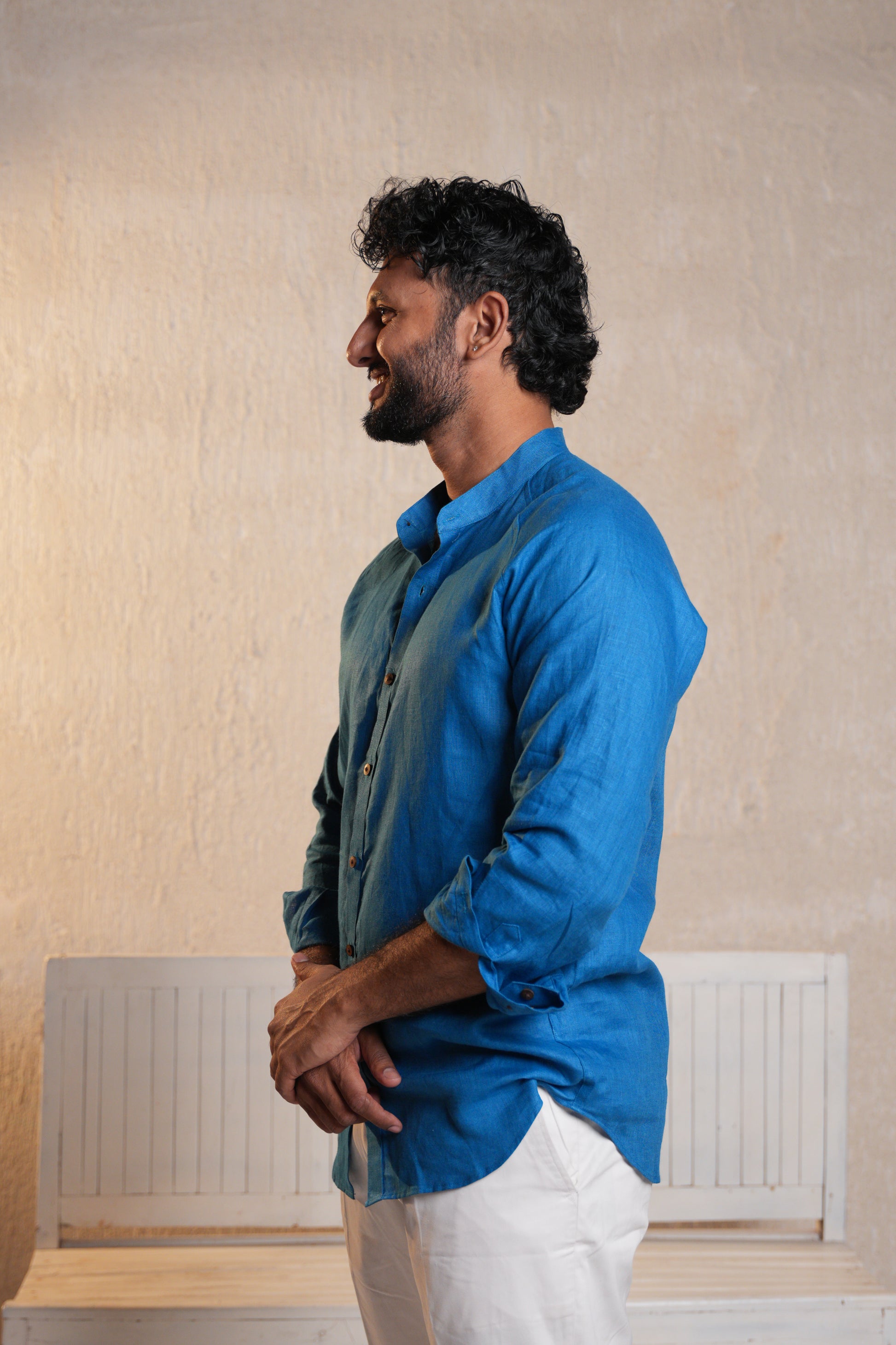 Close-up of a deep blue raglan sleeve shirt, showcasing the smooth fabric and signature raglan sleeve cut.