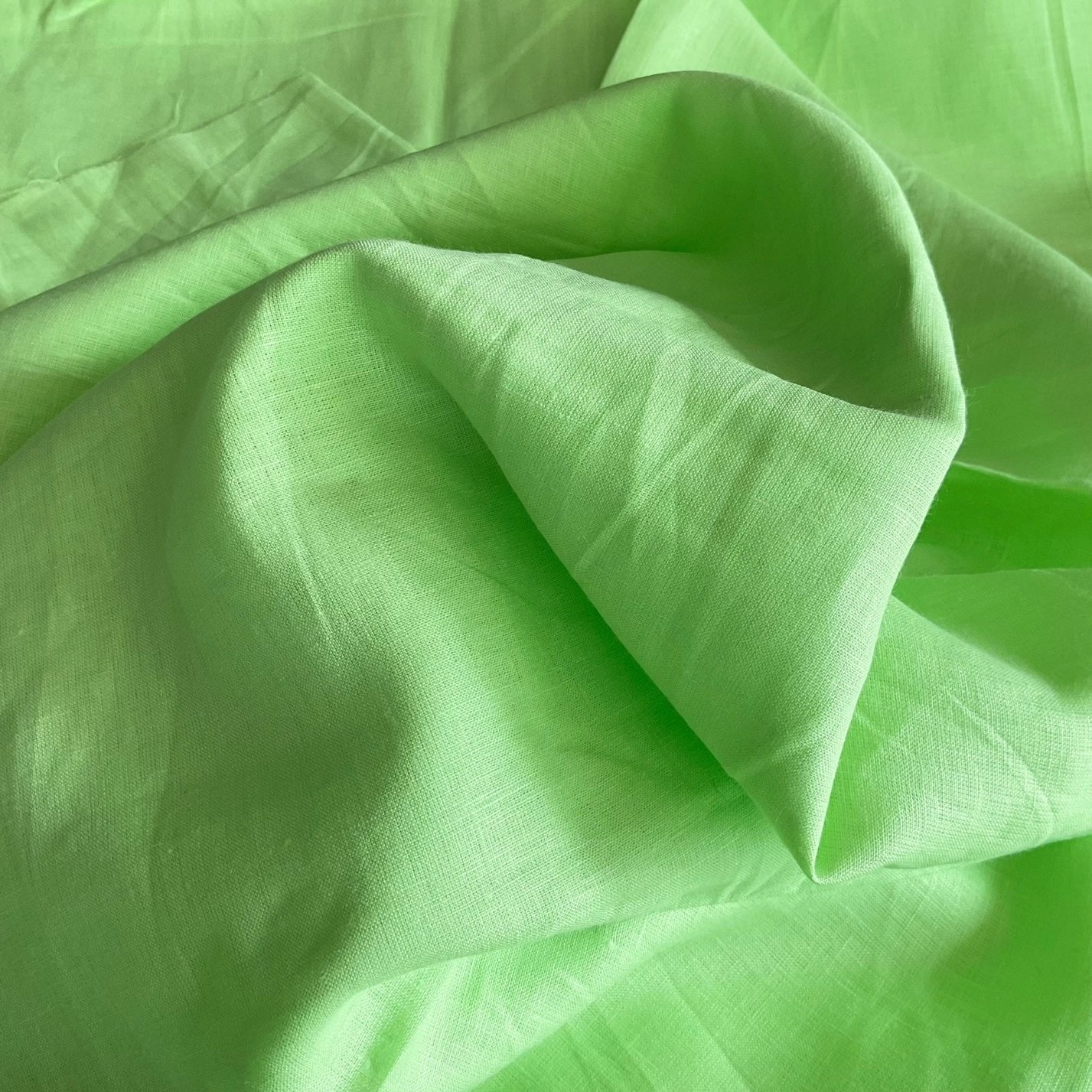 Natural linen fabric with a textured finish, ideal for summer clothing and home decor.